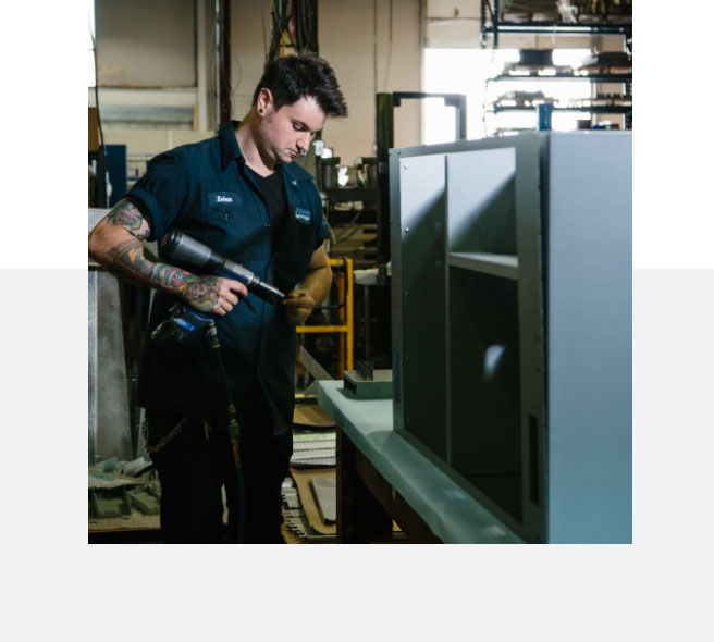 Wesgar employee assembling a sheet metal product