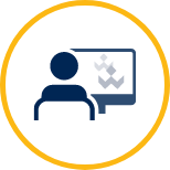 Icon image of person sitting in front of computer