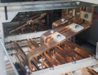 image of bus bars being assembled into custom sheet metal product